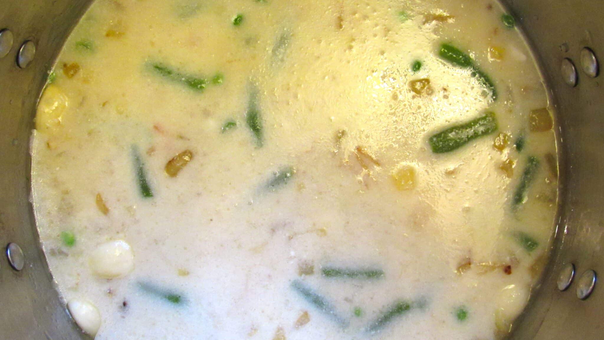 Close-up image of cooked soup in a pot.