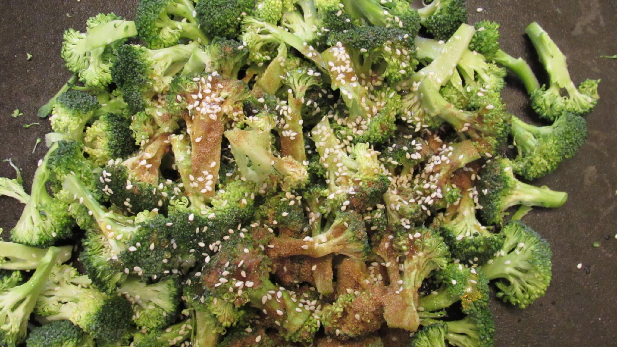 Broccoli florets are seasoned.