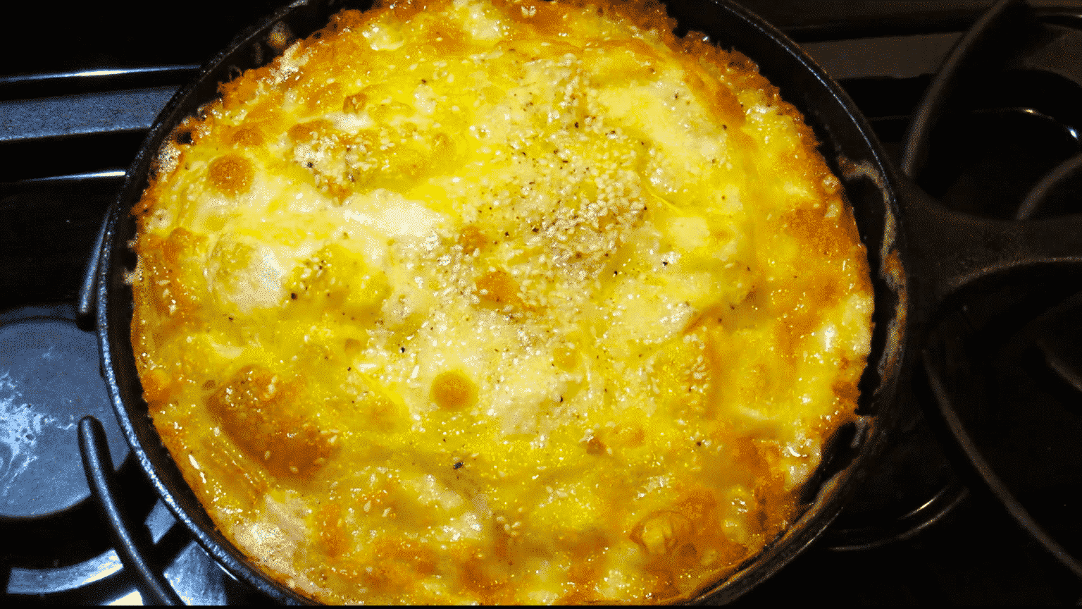 Sourdough starter, egg and cheese breakfast casserole skillet baked in the oven ready to serve.