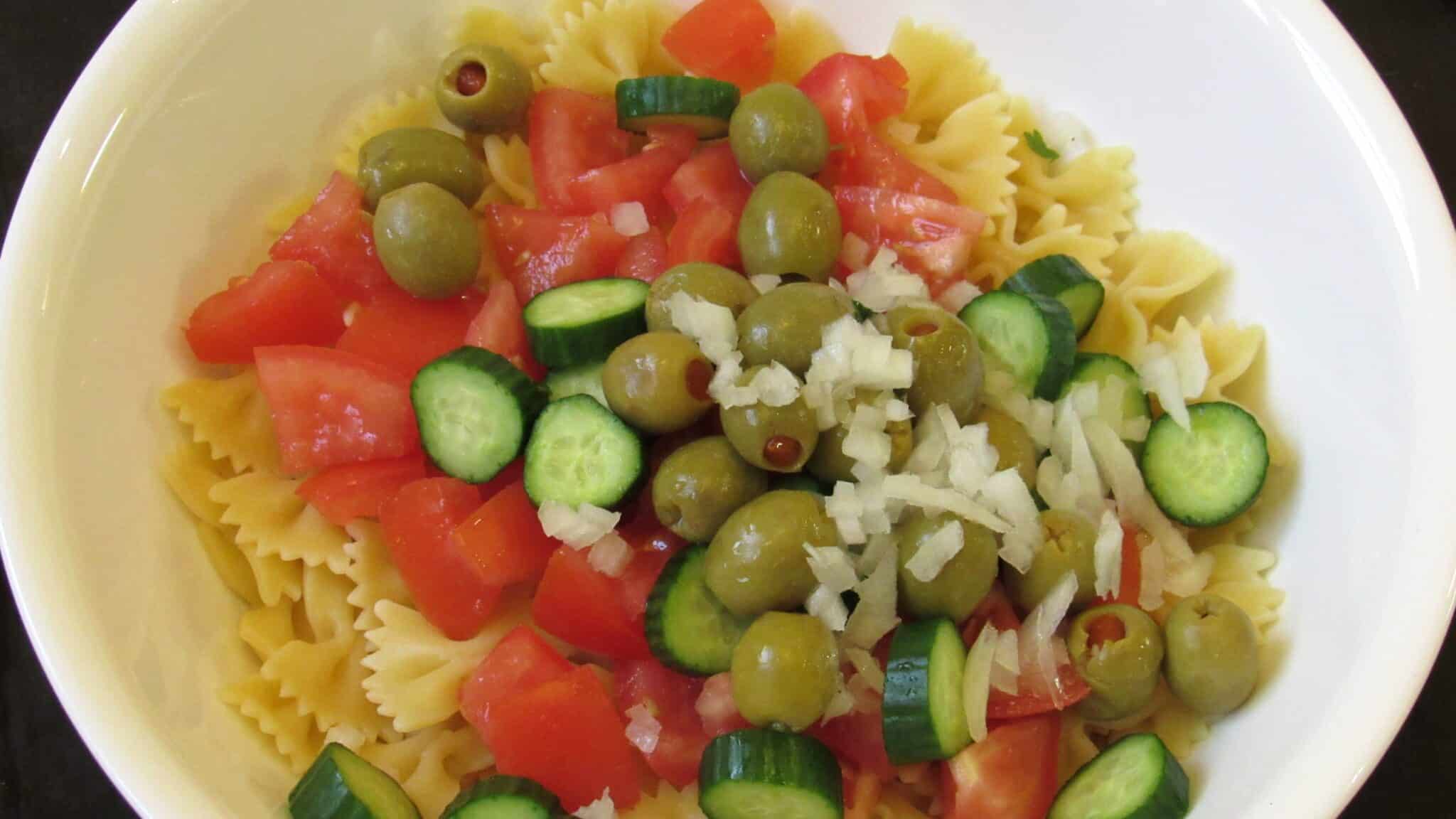 The rest of the ingredients are added to the pasta salad.