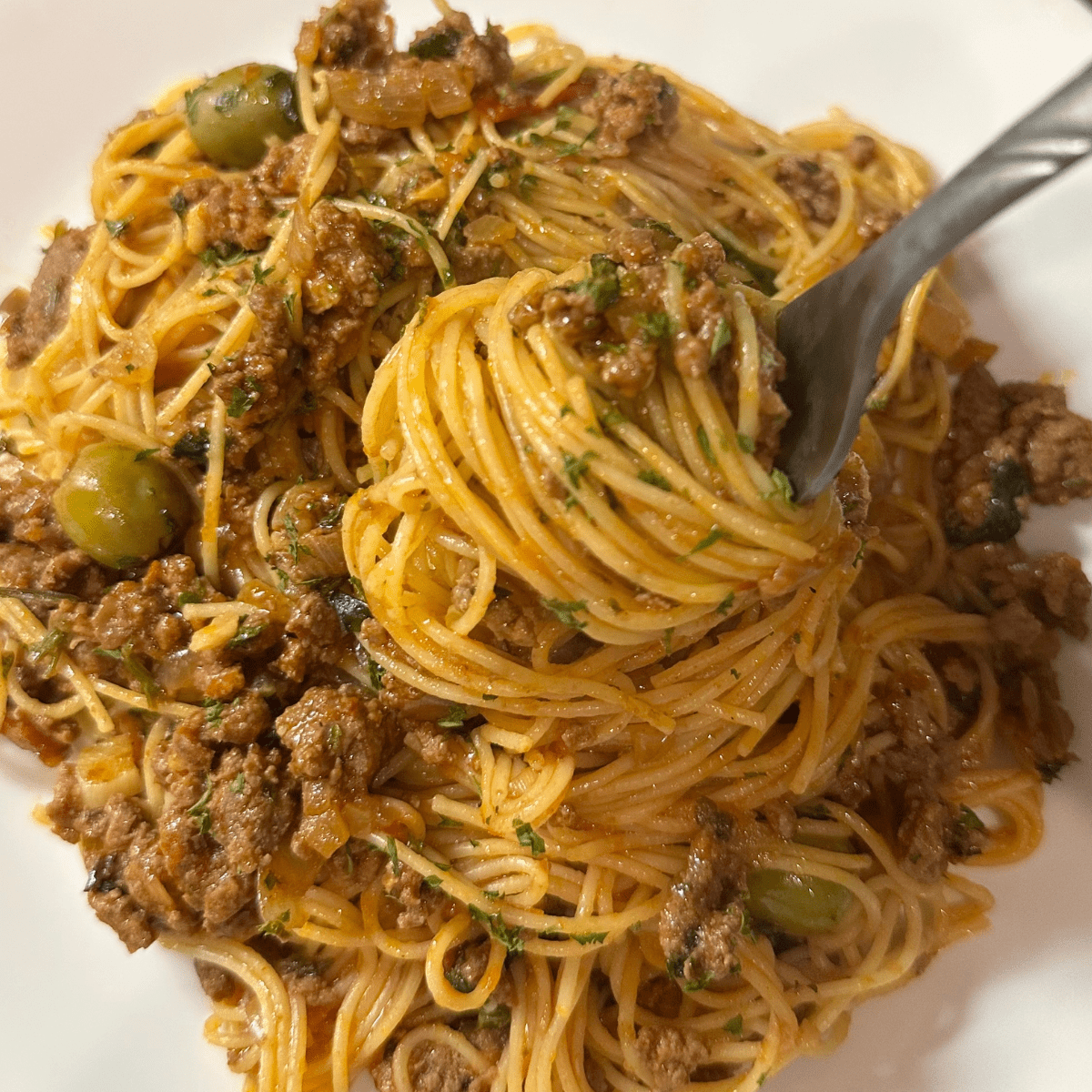 Spoon full of Best angle hair pasta with ground beef-close up image