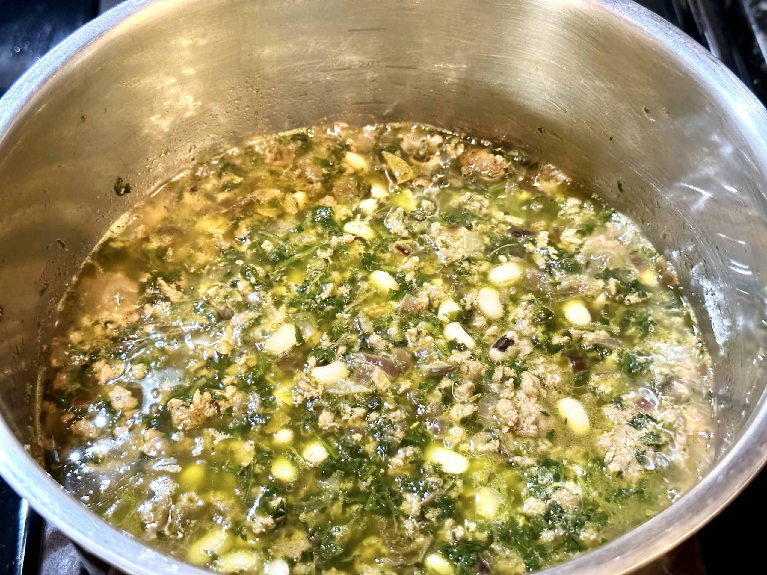 Water is added and gluten free hamburger soup is ready to simmer and cook.