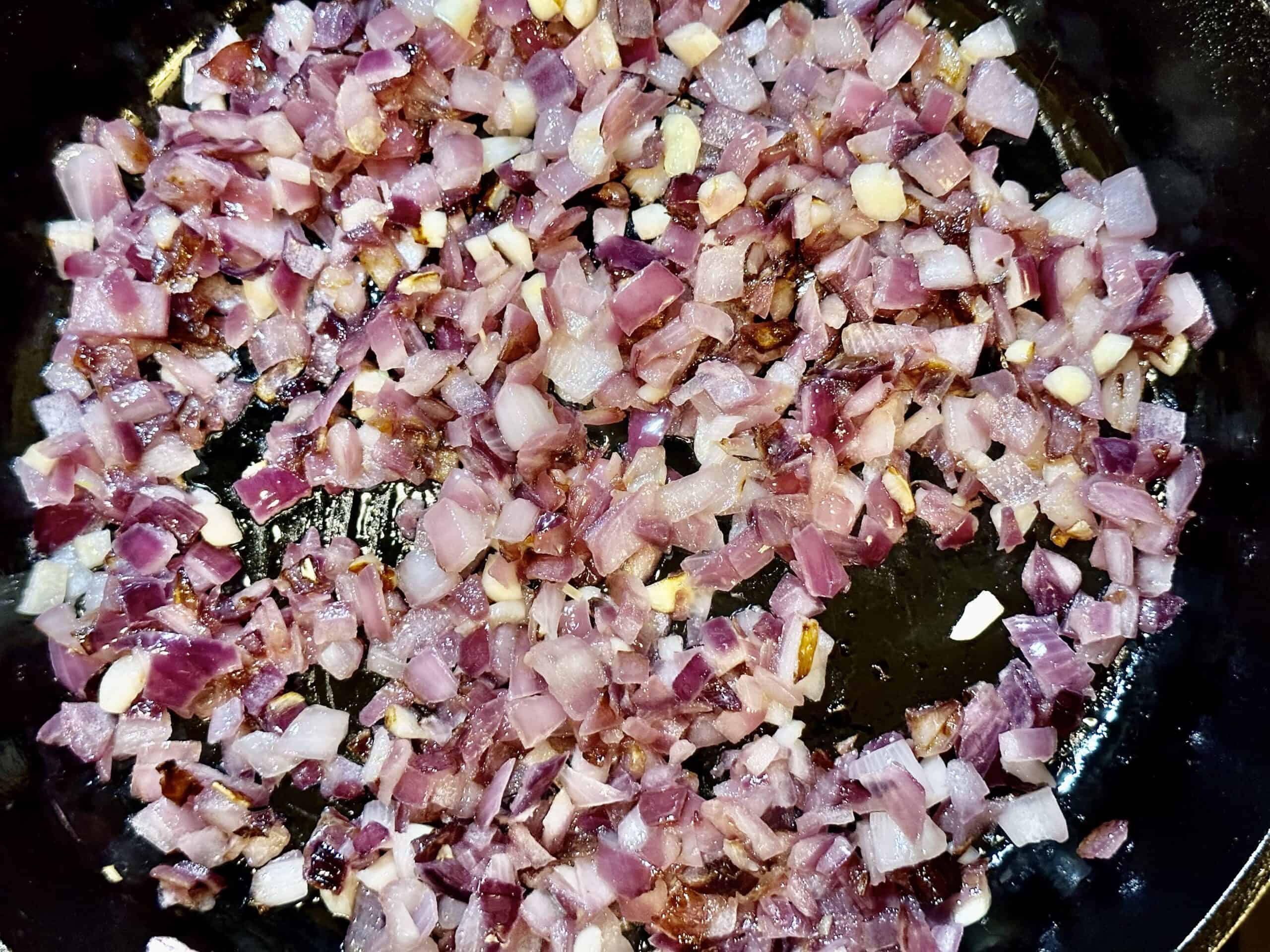 Process shot of sauté onion and garlic