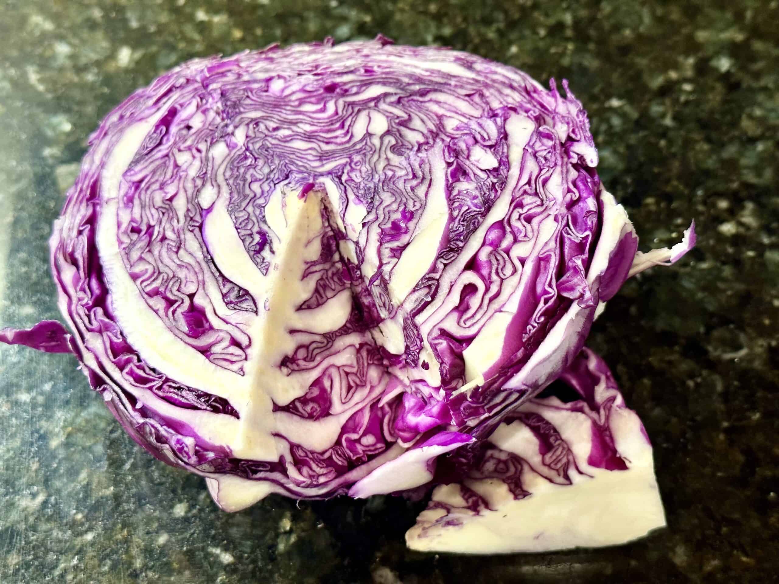 Half of a red cabbage. hard part is removed.