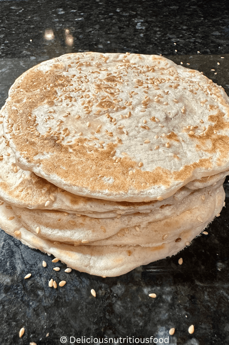 8 quick sourdough discard naan bread/ tortillas (No yogurt wraps) are served and stacked.