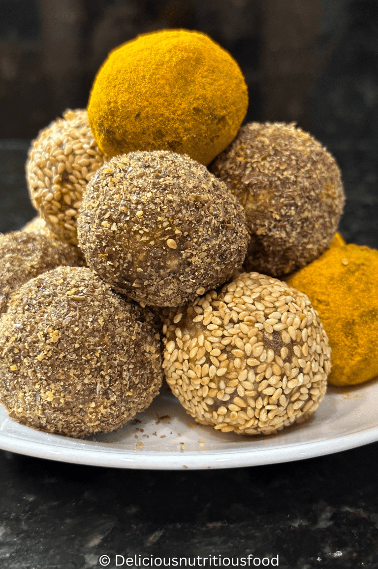 12 Turmeric energy balls are served in a white plate.