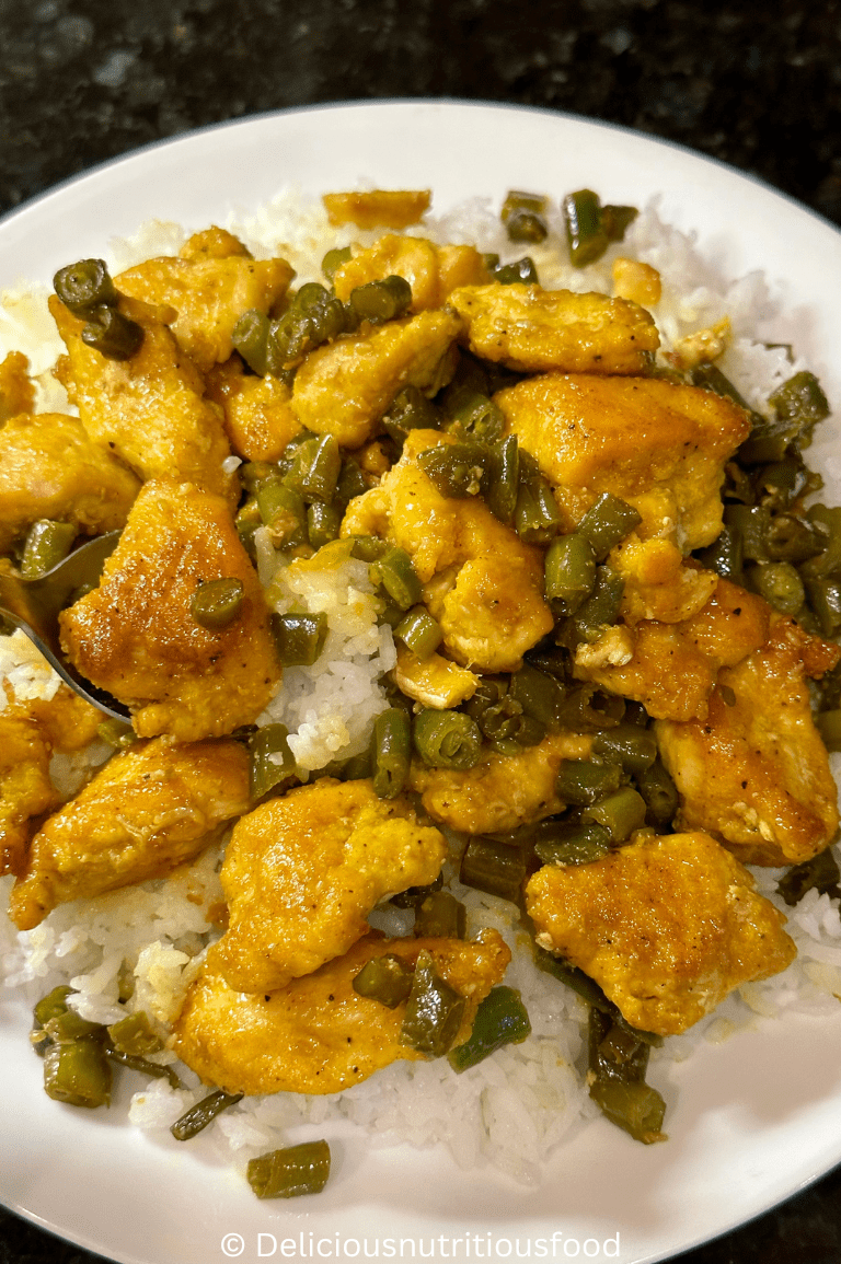 turmeric black pepper chicken is served with white rice